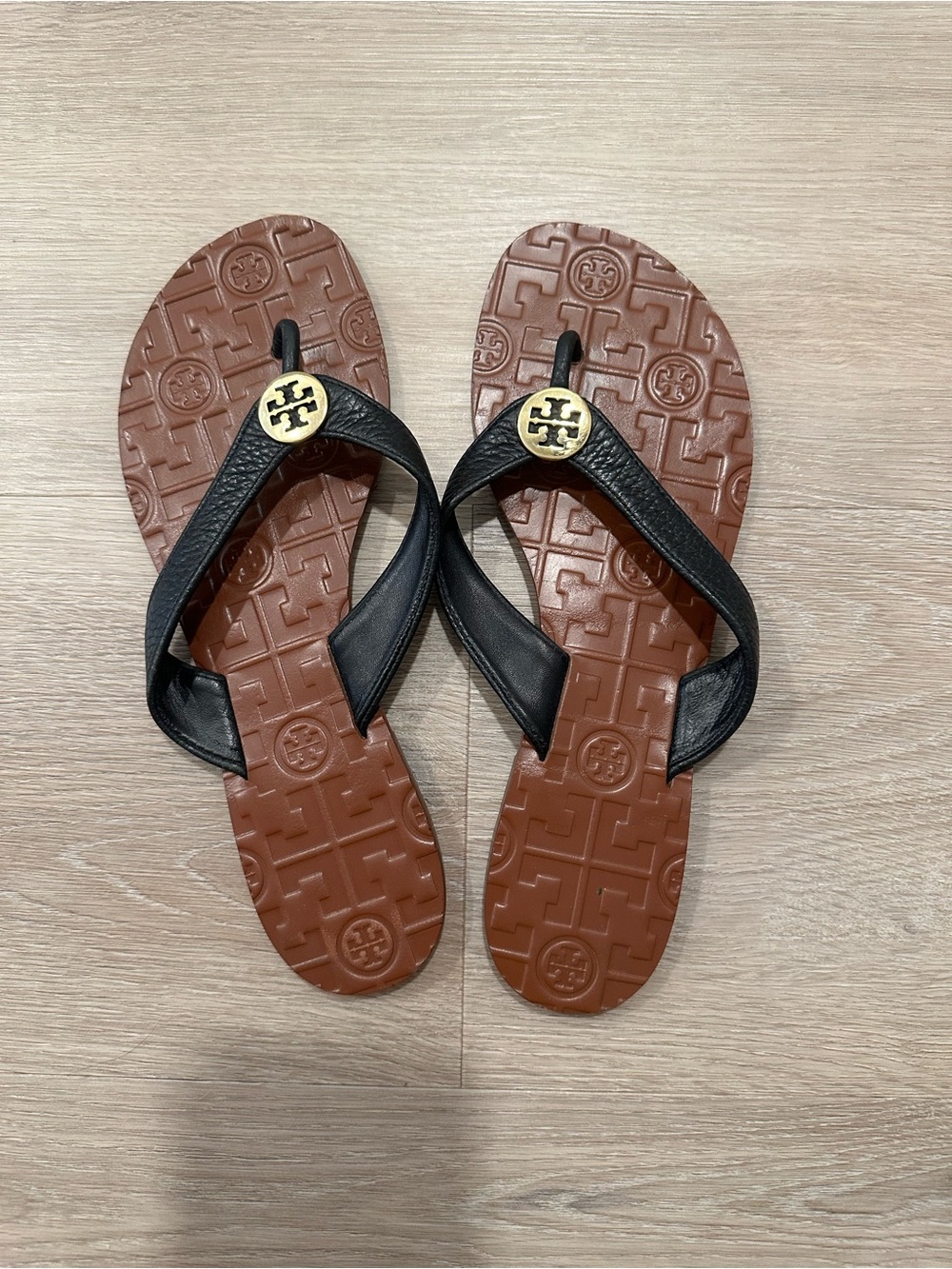 Tory Burch Thora Black Leather Thong Sandals with Gold Logo on Brown Footbed